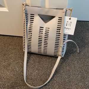 Grey shoulder handbag, purse is see through.